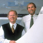 curt fentress and jim bradburn in front of denver airport model